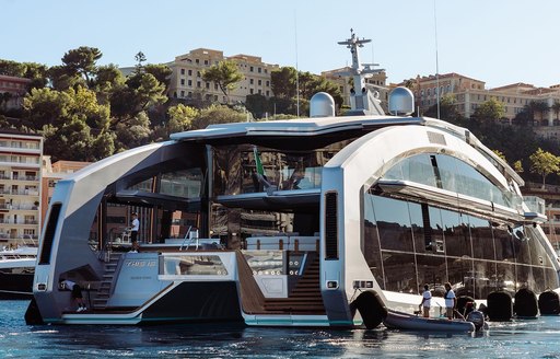 Aft view of charter yacht THIS IS IT at anchor in a bay