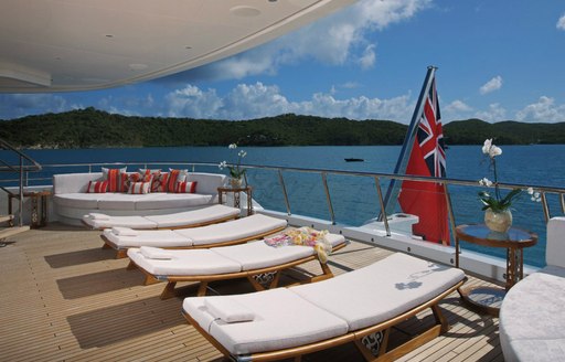 sun loungers in a row on aft deck of superyacht