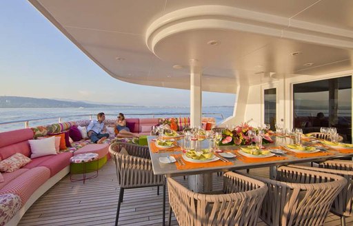 superyacht daloli exterior dining table and sofa seating 