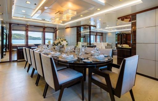 Charter yacht HOLDIN' MY OWN interior dining area with long table