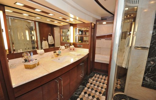 Ensuite facility with large sink unit and shower cubicle onboard boat charter VIVERE