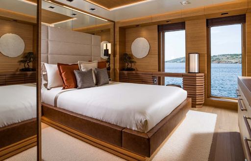 Double guest cabin with central berth and large windows onboard charter yacht LIFE SAGA