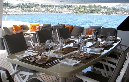 alfresco dining on upper aft deck of luxury yacht Costa Magna