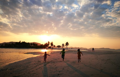 Kids playing on beach in Thailand