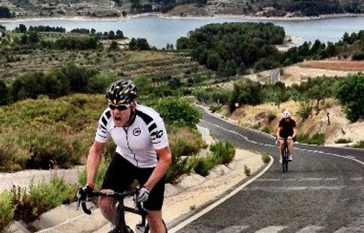 cogs for cancer bike rider training on mountainous coast of spain