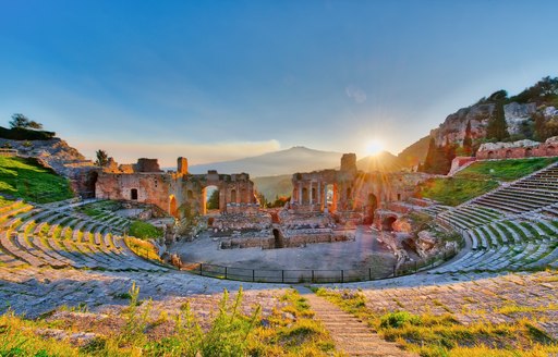 Greco-Roman theatre in Taormina in Sicily at sunset