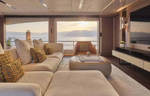 Charter yacht FOUR JOYS interior lounge with plush sofas