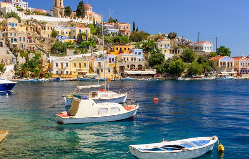 blue bay in greece, little town on the shore