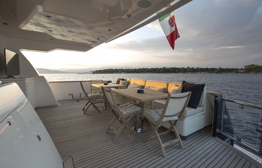 alfresco dining on aft deck of charter yacht cappuccino