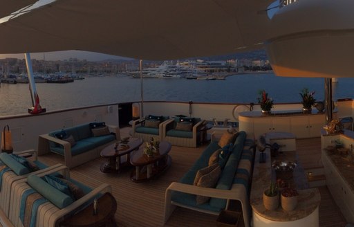 main aft deck seating and dining area on motor yacht 'Cocoa Bean'