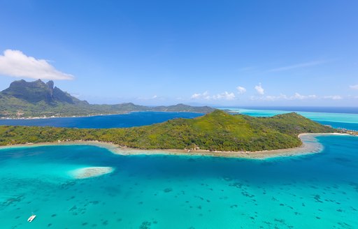 Yacht anchored down in beautiful lagoon Tahiti