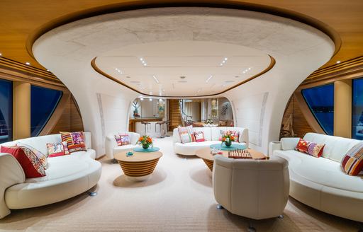 Upper salon lounge area with large windows onboard charter yacht SERENITY