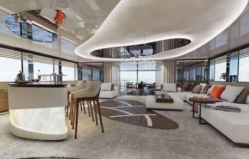 Overview of the main salon onboard charter yacht Eternal Spark, abundant seating surrounded by full height windows and a wetbar with stools forward