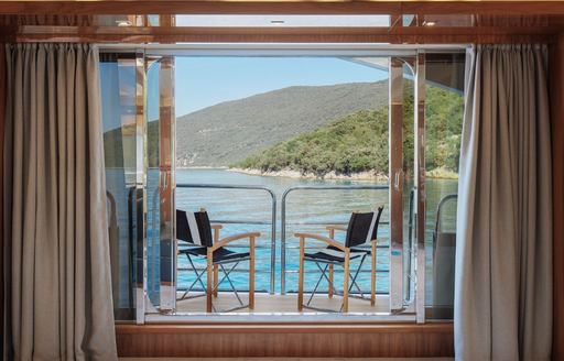 Charter yacht WICKED PLAY balcony with directors chairs