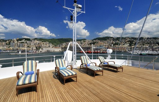 chaise loungers line up on the sundeck of luxury yacht Lauren L 