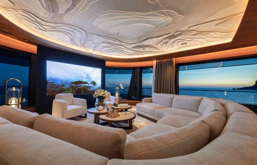 Charter yacht KENSHO cinema room and plush seating