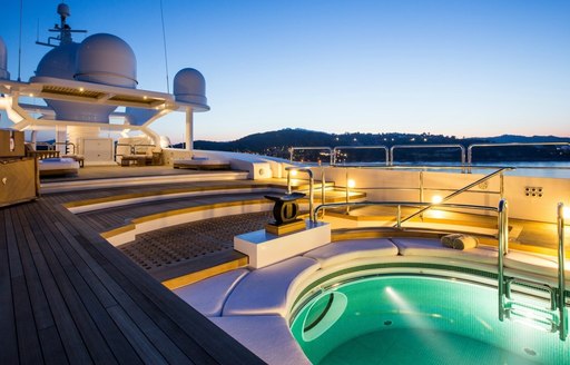 Pool on sundeck of superyacht Coral Ocean lights up at night