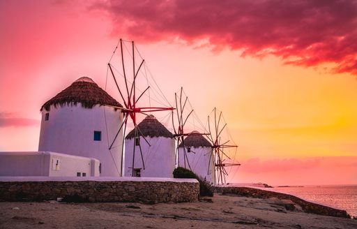 Line of Cycladic Windmills at sunset
