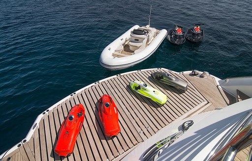 A collection of water toys gathered around the swim platform of superyacht PATHOS