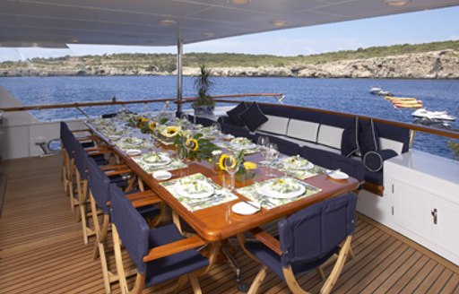 Al fresco dining on upper deck of superyacht TELEOST