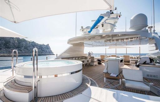 Jacuzzi on deck of superyacht ARBEMA with shade overhead