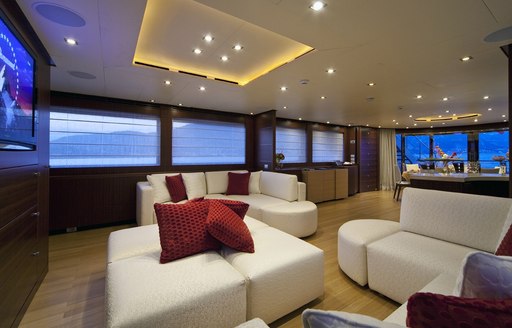 Cream sofas in lounge of superyacht Soiree