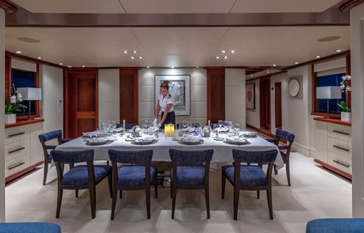 Charter yacht PISCES interior dining area with long table