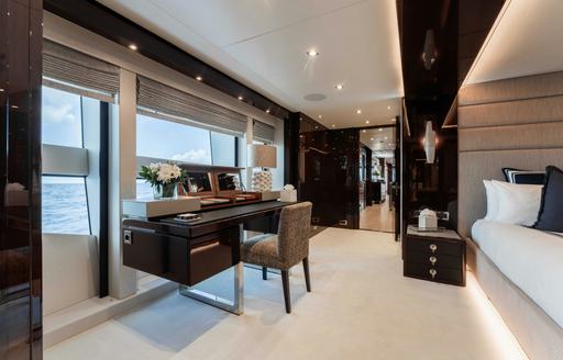 Luxury yacht charter CAPTAIN MORGAN III master cabin desk and window