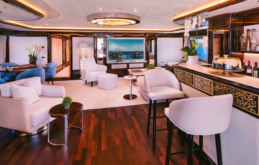 Charter yacht DILARA interior seating area and wet bar