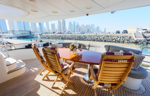 alfresco dining on main deck aft of charter yacht DXB 