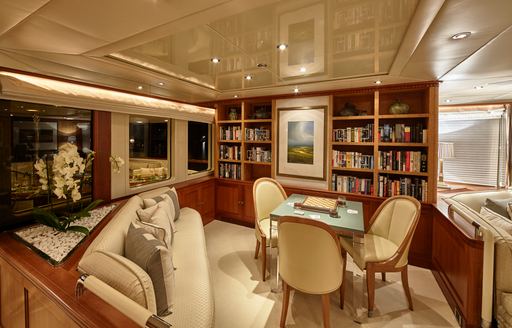 upper deck lounge with bookshelves on board luxury yacht KANALOA 