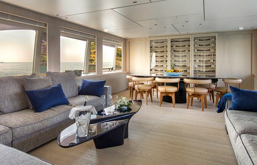 Interior of luxury yacht ARSANA with sofas lining walls