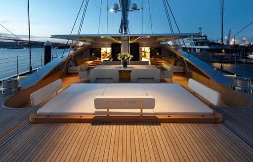 aft cockpit at night with Jacuzzi under sun pads on board charter yacht VERTIGO 