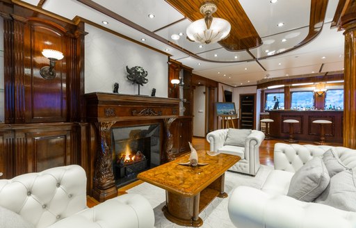 Fireplace and seating area on luxury yacht LEGEND