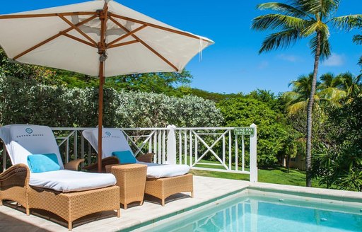 sun loungers and pool at luxury cotton house spa in Mustique