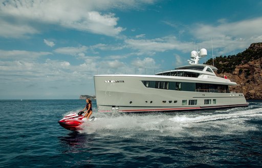 charter guest enjoys jet skis on superyacht delta one