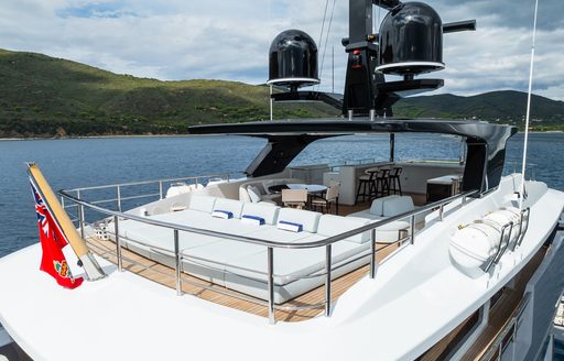 Overview of the sundeck onboard charter yacht M with multiple sun pads