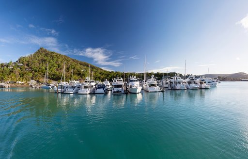 Yachts anchor in the serene, crystal clear waters of the Whitsunday Islands, Queensland, Australia