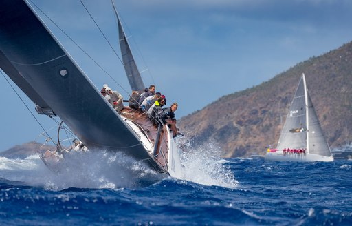 Crew on side of yacht as it passes by St Barths