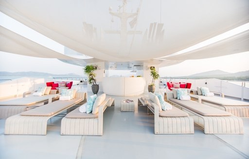 ample lounging options on the chic sundeck aboard motor yacht SALUZI