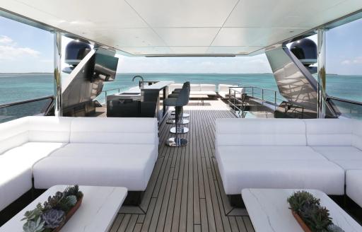 Sun deck lounge area onboard charter yacht A SALT WEAPON