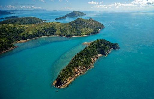 Whitsundays island bar in Australia, with green landscapes and sapphire-blue seas