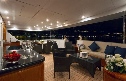 luxury motor yacht L'ALBATROS deck seating area with bar