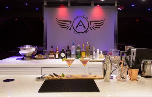 The logo of superyacht ASCARI lit up inside of the yacht