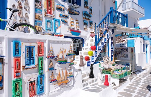 Colourful home on street of Mykonos, the ideal yacht charter destination