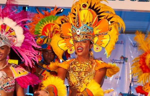 dancer with Vibrant head and shoulder pieces at junkanoo carnival