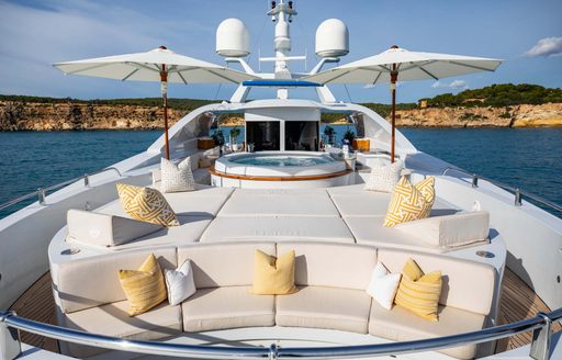 Sun pads onboard charter yacht LA BLANCA with yellow cushions