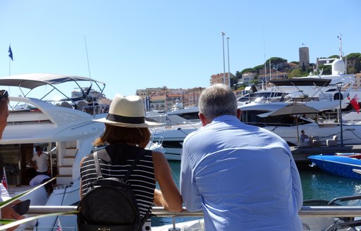 Attendees at cannes yachting festival 2019 enjoying the sun