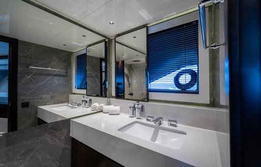 Master cabin en suite onboard charter yacht GLASAX, with white sink unit