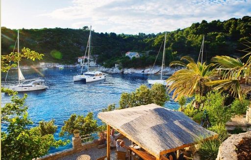 yachts in the beautiful Tatinja Bay, Solta island, Croatia yacht charter opposite the gorgeous Lonely Planet restaurant